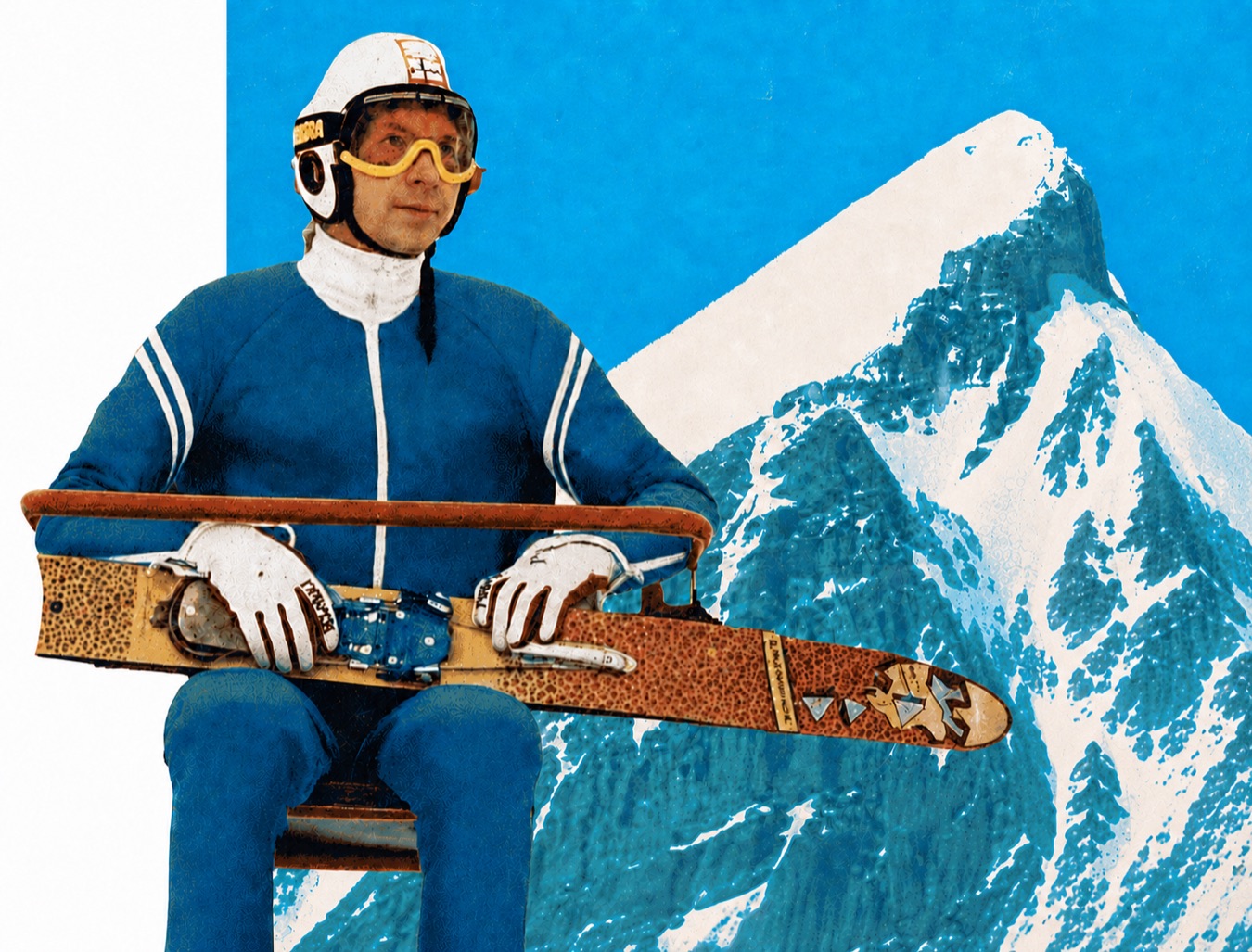 A skier in vintage gear on the chairlift, against the peaks above Fernie